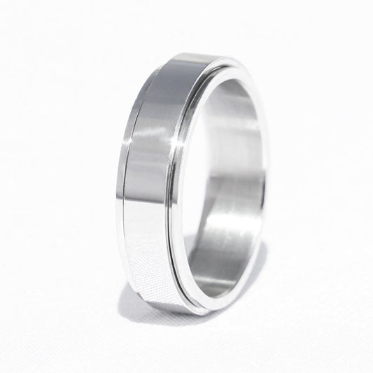Silver anxiety ring with a smooth polished design displayed against a white background