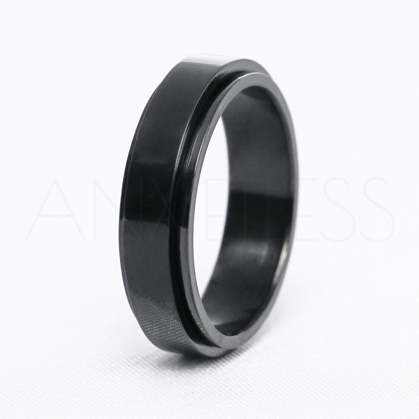 Black anxiety ring with a smooth polished design displayed against a white background