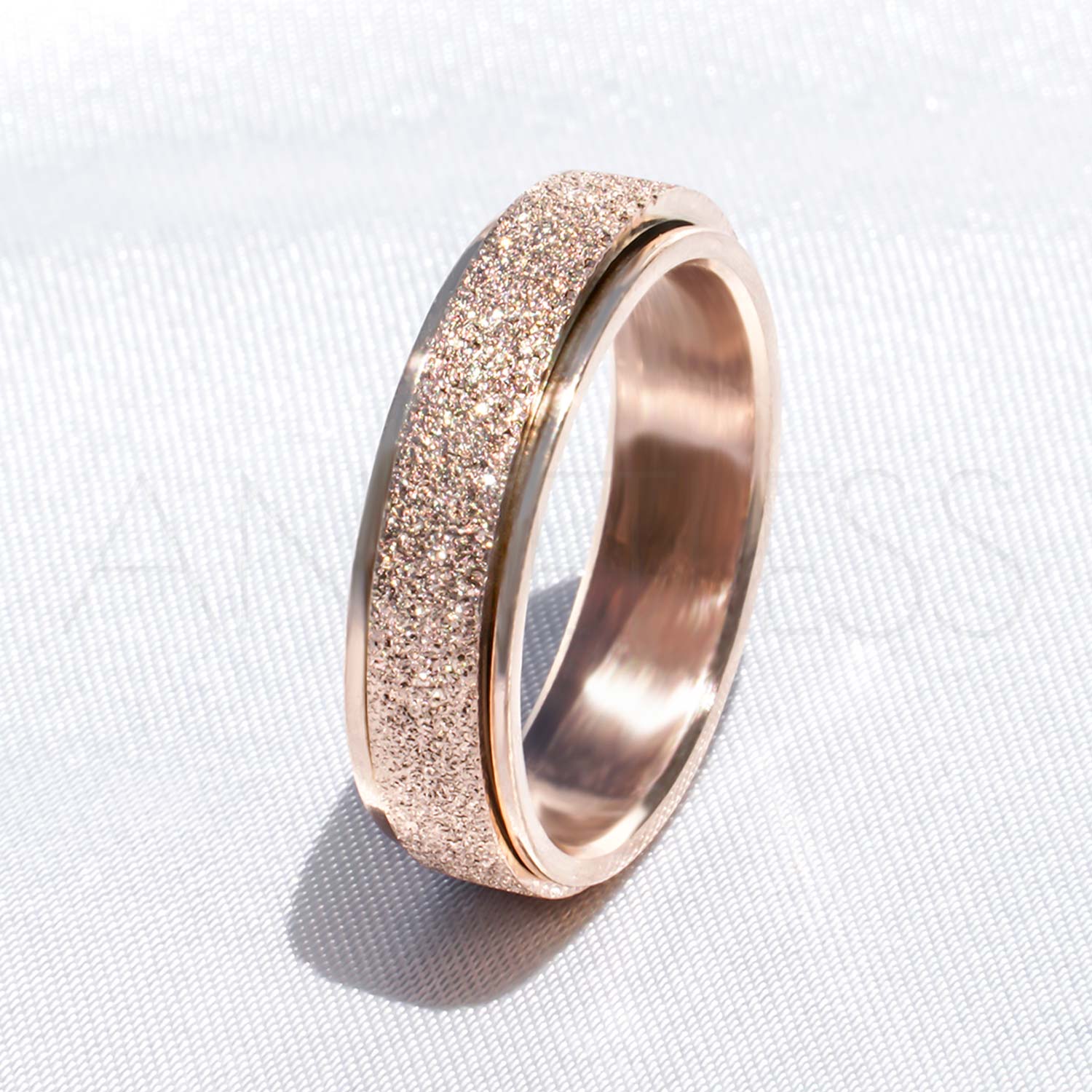 Sparkly Rose gold Anxiety Ring on White Background