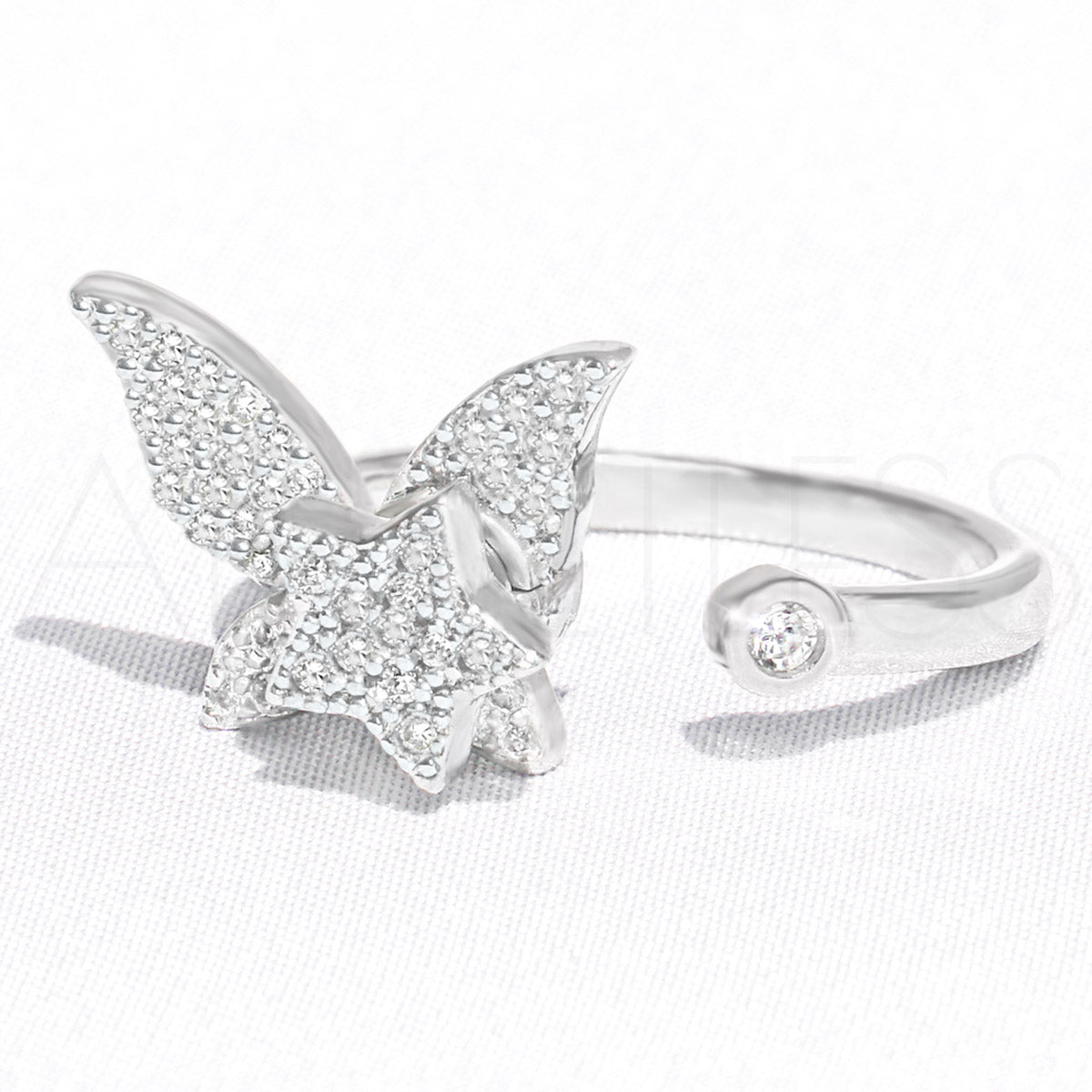 Silver butterfly anxiety ring with star charm, adjustable size, on white background