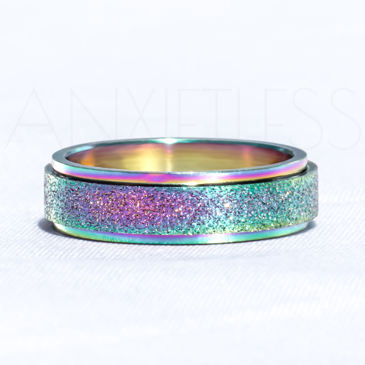 Sparkly Rainbow Anxiety Ring Laid Flat on White Background