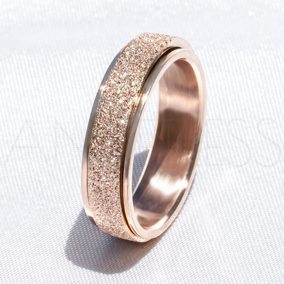 Sparkly Rose Gold Anxiety Ring on White Background