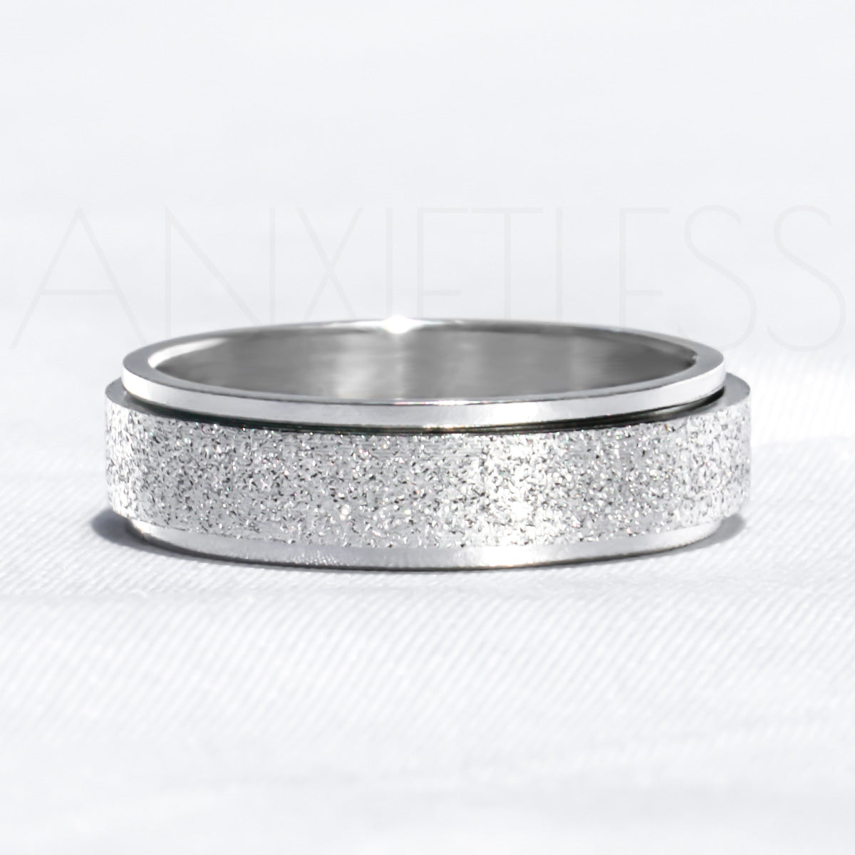 Sparkly Silver Anxiety Ring Laid Flat on White Background